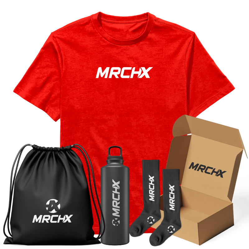 A red t-shirt with "MRCHX" branding, accompanied by a water bottle, socks, a drawstring bag, and a box.